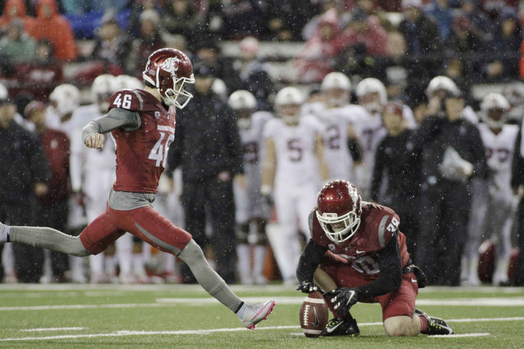 Washington State place kicker Erik Powell (46) kicks a field goal as wide receiver Kaleb Fossum (38) holds during the first half of an NCAA college football game against Stanford, Saturday, Oct. 31, 2015, in Pullman, Wash.