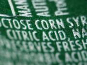 A nutrition label that lists high fructose corn syrup as an ingredient in a can of soda.