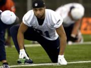 Wide receiver Golden Tate stretches during practice before the Super Bowl.