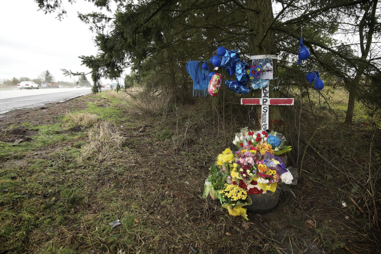 An impromptu memorial along Interstate 5 marks the spot where Serge Bondarchuck, a senior at Fort Vancouver High School, was killed in a Feb.