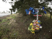 An impromptu memorial along Interstate 5 marks the spot where Serge Bondarchuck, a senior at Fort Vancouver High School, was killed in a Feb.