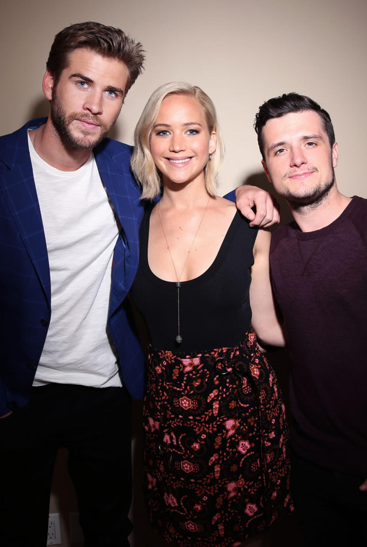 Actors Liam Hemsworth, from left, Jennifer Lawrence and Josh Hutcherson, from &quot;The Hunger Games: Mockingjay -- Part 2,&quot; are friends, not just co-stars.