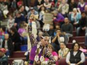 Keeli Little Leaf of Warm Springs, Ore., dances a jingle dance at the Native American Indian Education Program Title VII Traditional Pow Wow in March 2013 at Covington Middle School.