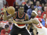 The Blazers’ Al-Farouq Aminu (left) is one of four NBA players with at least a 12.8 rebound percentage and taking more than 40 percent of their shots from 3-point range.