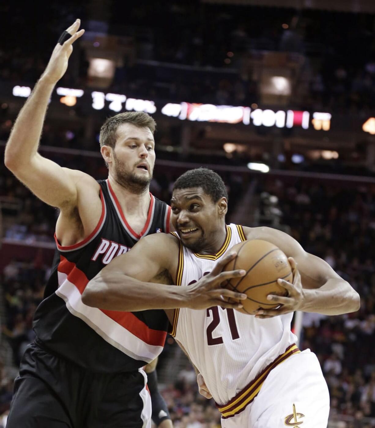 Portland Trail Blazers' Joel Freeland, left, playing against Cleveland's Andrew Bynum, has been steady in the Blazers lineup with his offensive rebounding skills.