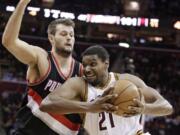 Portland Trail Blazers' Joel Freeland, left, playing against Cleveland's Andrew Bynum, has been steady in the Blazers lineup with his offensive rebounding skills.