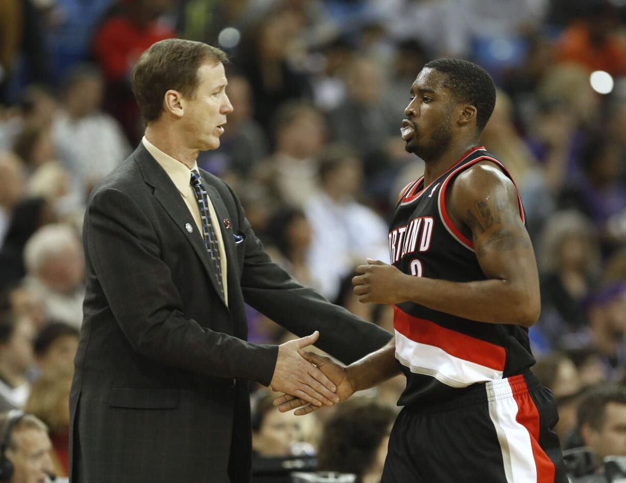 Portland Trail Blazers head coach Terry Stotts greets guard Wesley Matthews as he comes off the court during the fourth quarter of an NBA basketball game against the Sacramento Kings in Sacramento, Calif., Saturday, Nov. 9, 2013.