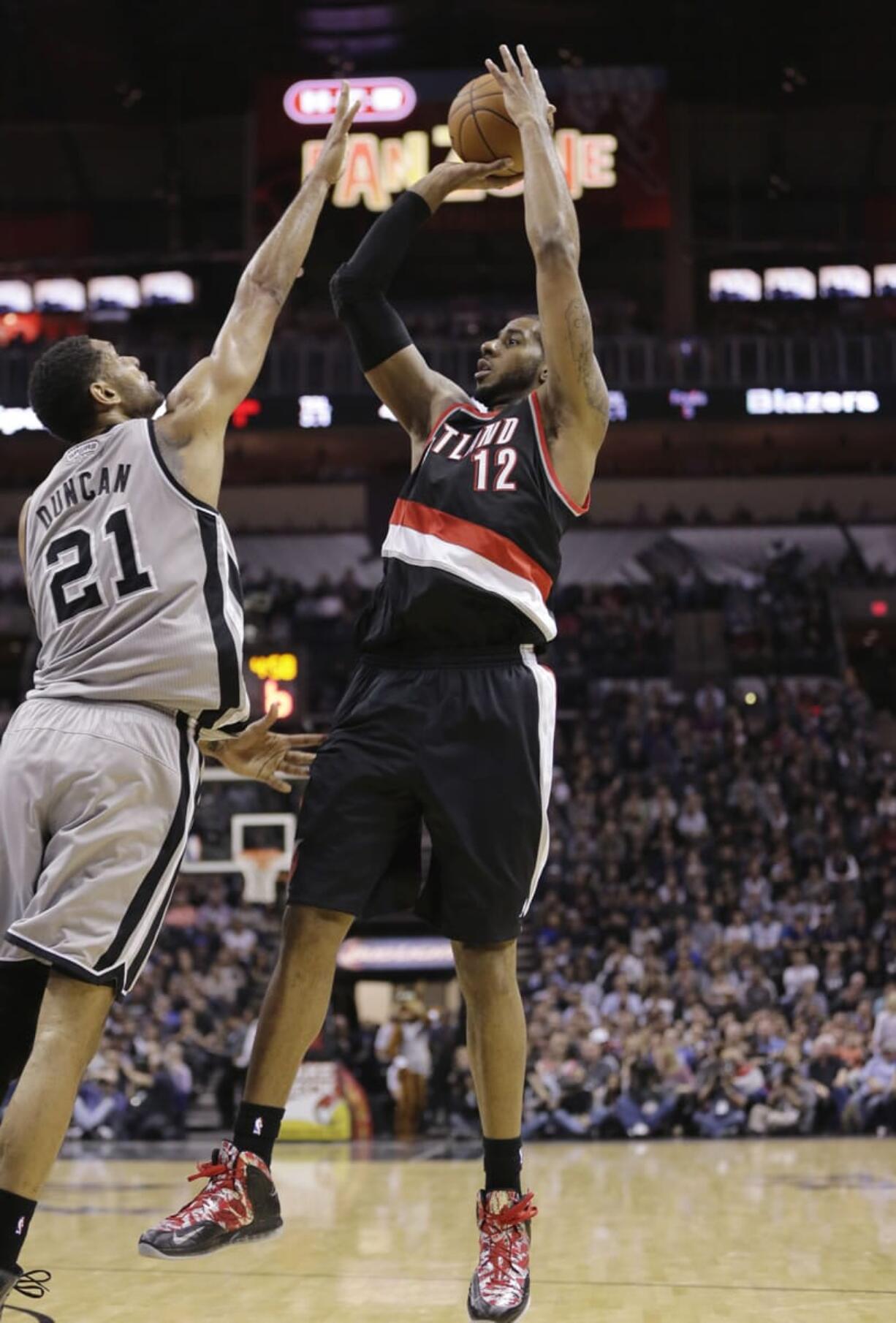 Portland's LaMarcus Aldridge (12), shooting over San Antonio's Tim Duncan during Friday's win, has had a solid first half of the season for the Trail Blazers.