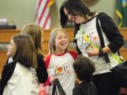 West Minnehaha: Michele Larsen, right, laughs with her daughter Taryn during a Junior Joy Team visit last year to Vancouver city council chambers.