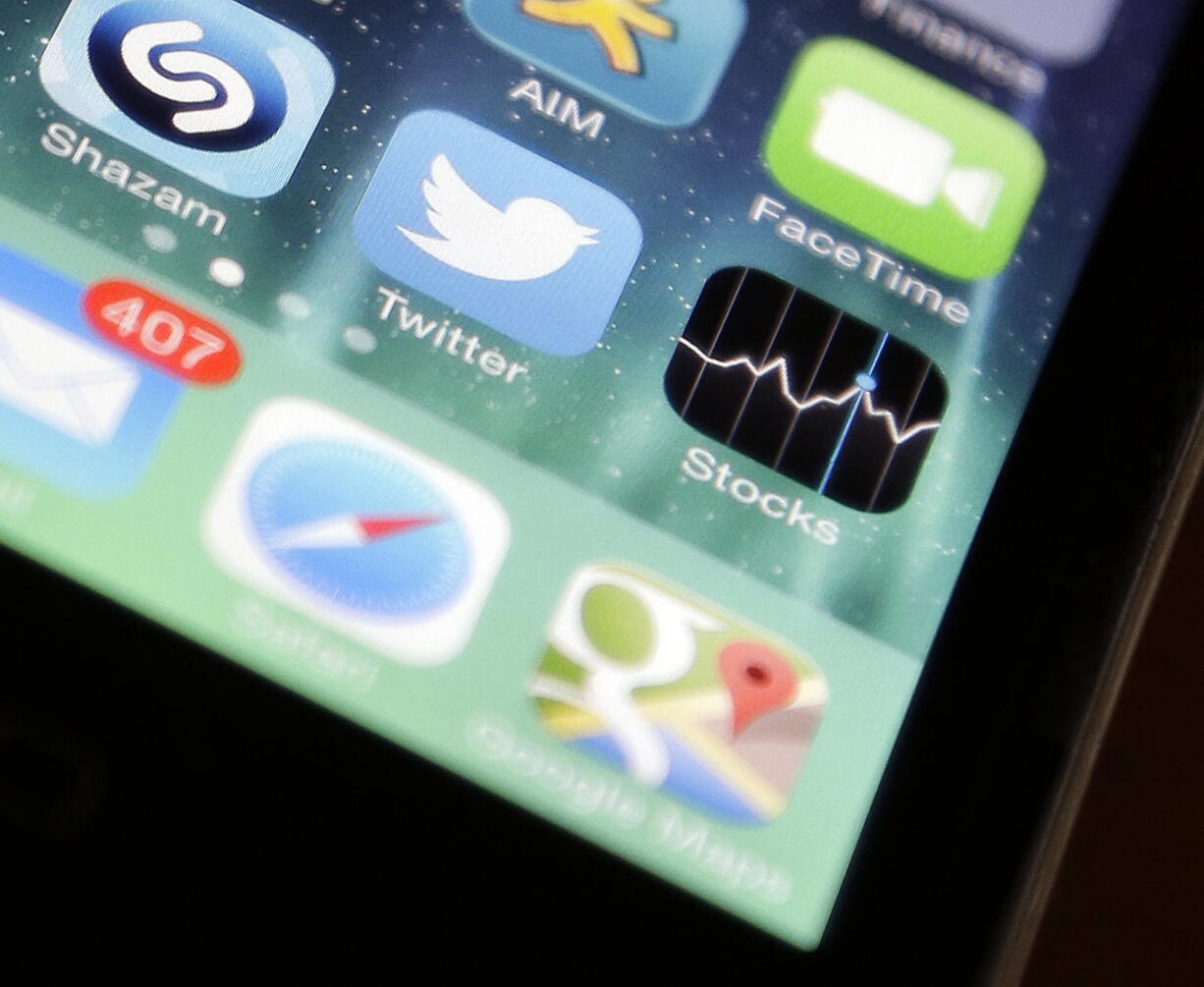 The Twitter app is shown on an iPhone 4s, in San Jose, Calif.