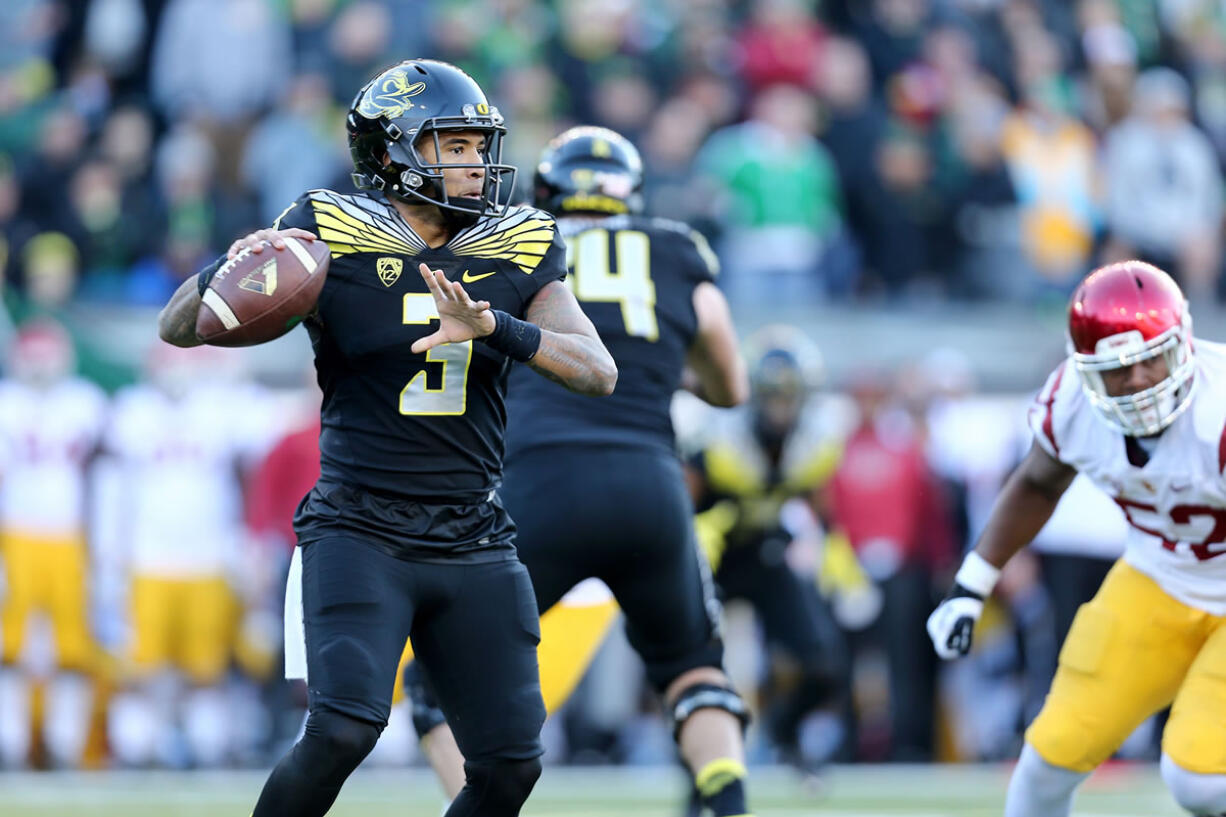 Oregon quarterback Vernon Adams Jr. (3) looks to pass during the second half of an NCAA college football game against Southern California, Saturday, Nov. 21, 2015, in Eugene, Ore.