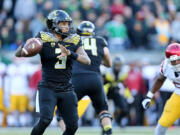 Oregon quarterback Vernon Adams Jr. (3) looks to pass during the second half of an NCAA college football game against Southern California, Saturday, Nov. 21, 2015, in Eugene, Ore.