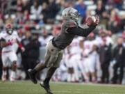 Washington State wide receiver Kristoff Williams (18) catches a pass from Connor Halliday during the first half against Utah on Saturday.