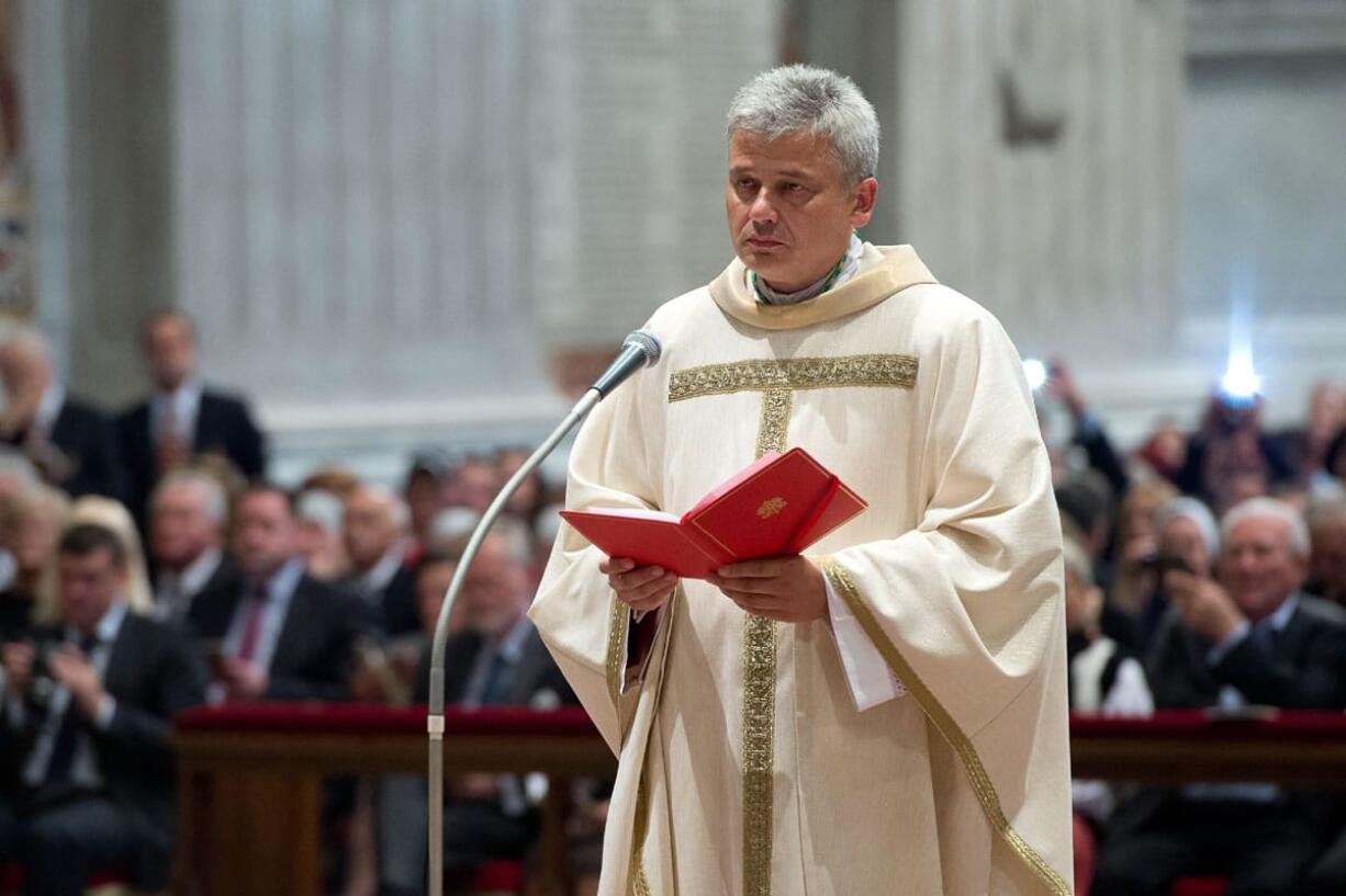 In this photo taken on Sept.19, 2013 provided by the Vatican newspaper L'Osservatore Romano, Vatican Almoner, Archbishop Konrad Krajewski attends the ceremony for his episcopal ordination, in St. Peter's Basilica, at the Vatican. The existence of the Vatican Almoner dates back centuries: It is mentioned in a papal bull from the 13th-century Pope Innocent III, and Pope Gregory X, who ruled from 1271-1276, organized it into an official Holy See office for papal charity. Up until Krajewski came along, the almoner was typically an aging Vatican diplomat who was serving his final years before being allowed to retire at age 75. Francis changed all that, tapping the 50-year-old Pole to be a more vigorous, hands-on extension of himself. The almoner's duties are two-fold: carrying out acts of charity, and raising the money to fund them.