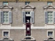 Pope Francis delivers his blessing during the Angelus noon prayer he celebrated from the window of his studio overlooking St. Peter's Square at the Vatican on Wednesday. &quot;We are all children of one heavenly father, we belong to the same human family and we share a common destiny,&quot; Francis said, as tens of thousands of faithful, tourists and Romans jammed St.