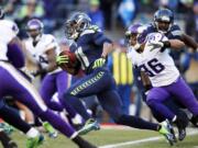 Seattle Seahawks' Percy Harvin (11) returns the ball against the Minnesota Vikings on a kick off in the first half of an NFL football game Sunday, Nov.