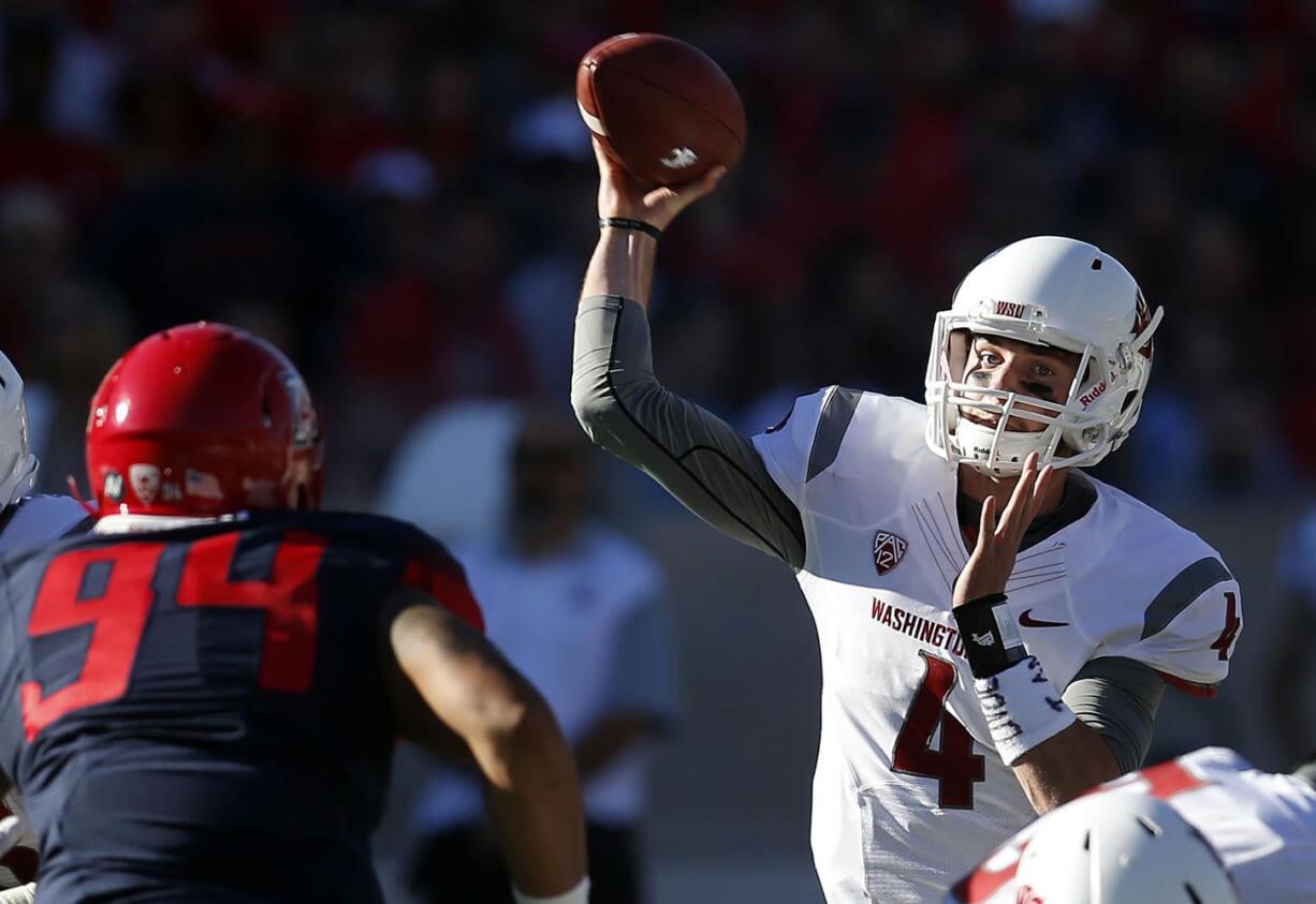 Washington State quarterback Luke Falk (4) throws down field against Arizona. The Cougars have won five of their past six games, and are coming off a 31-27 last-second win at UCLA.