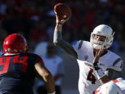 Washington State quarterback Luke Falk (4) throws down field against Arizona. The Cougars have won five of their past six games, and are coming off a 31-27 last-second win at UCLA.