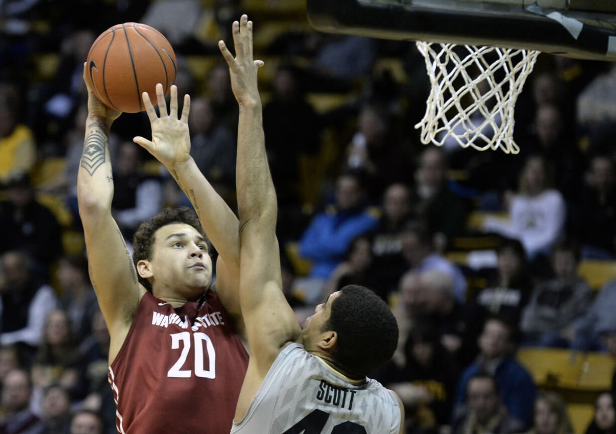 Washington State's Jordan Railey shoots over Colorado's Josh Scott during an NCAA basketball game on Wednesday, Feb. 5, 2014, in Boulder, Colo.