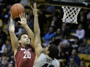 Washington State's Jordan Railey shoots over Colorado's Josh Scott during an NCAA basketball game on Wednesday, Feb. 5, 2014, in Boulder, Colo.