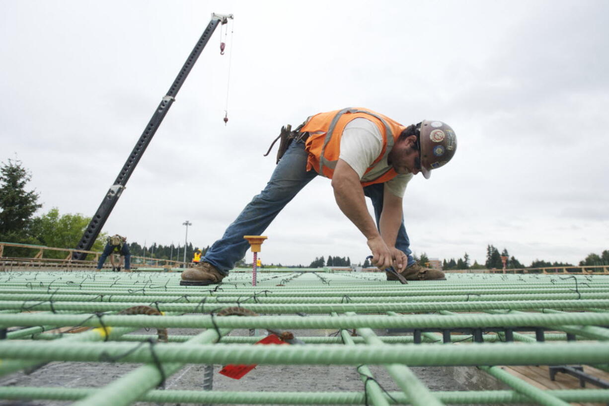 Will Chandler of Vancouver works on the Salmon Creek Interchange Project in September.