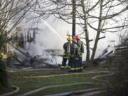 Vancouver firefighters work to control a fire at 4201 N.E. 59th Ave.