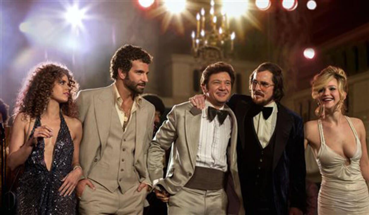 Amy Adams,from left, Bradley Cooper, Jeremy Renner, Christian Bale and Jennifer Lawrence in a scene from &quot;American Hustle.&quot;