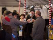 Terry Johnson, from left, Jennifer Hewett, David Hewett and Ryan Tofell, all from Vancouver, attend last year's Vancouver Winter Brewfest.