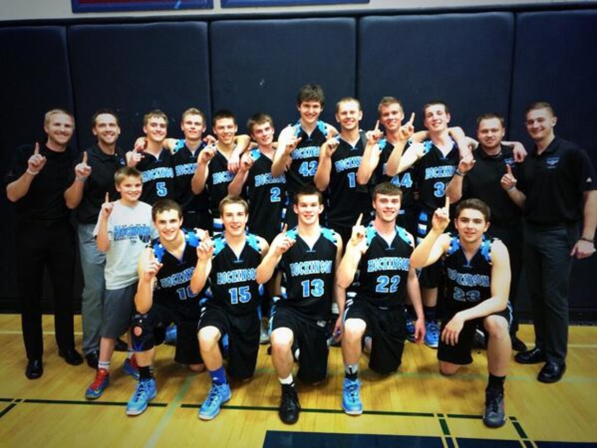 The Hockinson boys basketball team poses after winning their six-team bracket of the Surf n Slam Tournament in San Diego.