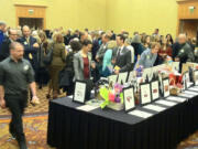 Library supporters browse items up for auction Thursday at the 2013 Authors &amp; Illustrators Dinner benefiting the Fort Vancouver Regional Library Foundation.