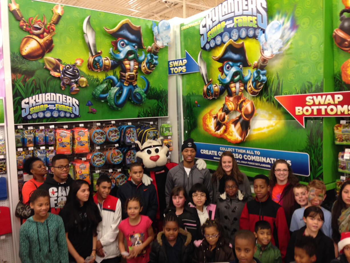 Blazers guard Damian Lillard surprised 30 lucky kids from the Boys and Girls Club of Portland at the Toys 'R Us in Jantzen Beach on Thursday night.