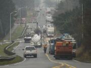 Emergency crews work to clean up a tanker truck accident on Northeast 18th street Friday in Vancouver.