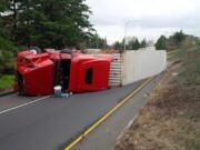 A tractor-trailer carrying solar panels rolled over and blocked the ramp to eastbound state Highway 14. (Trooper D.