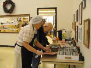 Volunteer Bessie Jarrel jokes with David Sanks at the Washougal Community Center during lunch, served daily by the Meals on Wheels People. The organization's goal is to expand the home delivery program to at least 100 people. &quot;Right now we only serve 40, and that's a shame,&quot; Washougal Center Manager Wanda Nelson said.