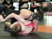 Washougal's Zach Oster turns Fort Vancouver's Isaiah Johnson on to his back and captures the 113-pound championship at the Washougal River Rumble Saturday.