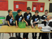 Before every FIRST LEGO League Robotics competition, a judge inspects the team's robot to ensure it meets requirements and asks questions. The Camas Mechanikids scored approximately 360 points, the highest of the contest.