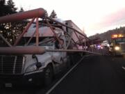 Photo by Battalion Chief Max Konkright, Clark County Fire &amp; Rescue
A sign bridge hit the windshield of this semi, narrowly missing its driver. The semi was traveling south on Interstate 5 behind another semi that knocked out the sign bridge and went through a guardrail, about two miles south of Woodland