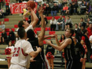 Trevor Jasinsky tries to keep a frantic fourth quarter comeback alive for the Papermaker boys basketball team.