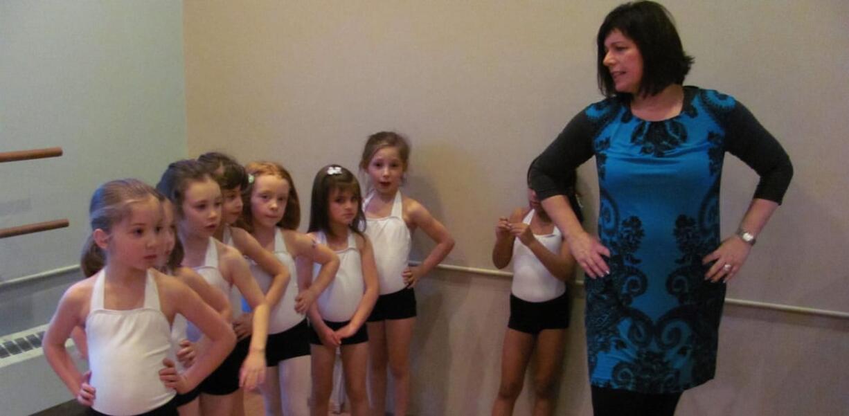 Candace Miller, program director at Virtuosity Performing Arts Studio, in Camas, teaches young dancers. The petite performance team class includes tap and jazz instruction.