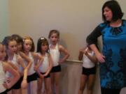 Candace Miller, program director at Virtuosity Performing Arts Studio, in Camas, teaches young dancers. The petite performance team class includes tap and jazz instruction.