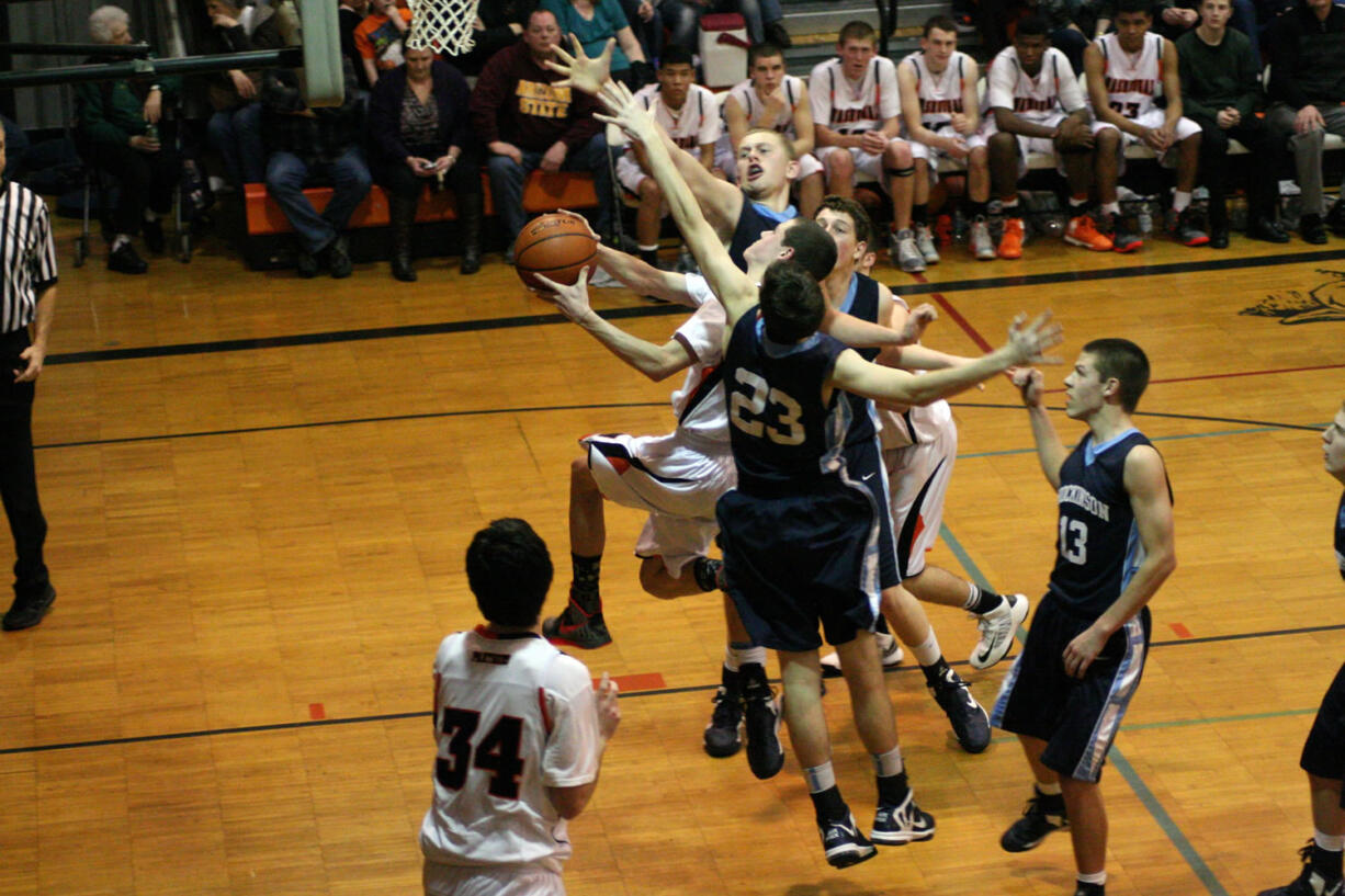 Three Hockinson defenders reach out in vain, but they are unable to stop Michael McElory.