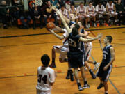 Three Hockinson defenders reach out in vain, but they are unable to stop Michael McElory.