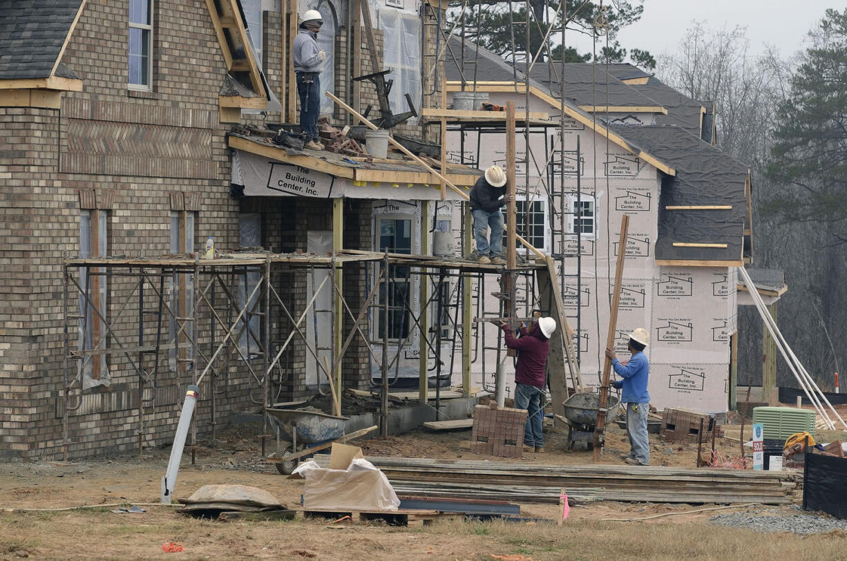 Construction crews build homes in Waxhaw, N.C.