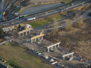 Contractors for the Washington State Department of Transportation are transforming the look of the area where Interstates 5 and 205 join, in the Salmon Creek area north of Vancouver. Piers that will carry the new Northeast 139th Street overpass over the traffic lanes are under construction on the west side of Interstate 5, in the foreground of this photo, which looks east. The storm drainage pond beyond the highway on the left edge of the photo is on the site of the old Salmon Creek Park &amp; Ride lot, which was closed for wetlands mitigation. The $133 million project will offer motorists an east-west alternative to Northeast 134th Street in the busy corridor that includes Washington State University Vancouver, Legacy Salmon Creek Medical Center, the new Park &amp; Ride, and the Salmon Creek Community Library.