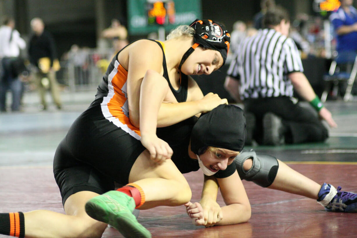 Sara Sanchez (left) lassoed a fifth place state medal from the Mat Classic Saturday, at the Tacoma Dome.