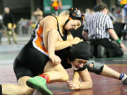 Sara Sanchez (left) lassoed a fifth place state medal from the Mat Classic Saturday, at the Tacoma Dome.