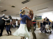 Russell Johnson and Molly Macdonald contra dance at the Hazel Dell Grange in December.