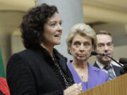 Paula Hammond, outgoing Washington state transportation secretary. speaks as former Gov. Chris Gregoire in 2010. New Gov.