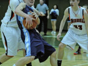 Greg Wahl-Stephens/For The Columbian
Washougal's Aaron Deister, left, battles against Hockinson's Alan Haagen during the Hawks' victory in a district playoff game.