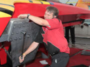 Vancouver resident Nelson Holmberg works on the Graham Trucking hydroplane during the Oryx Cup UIM World Championship in Doha Bay, Qatar.